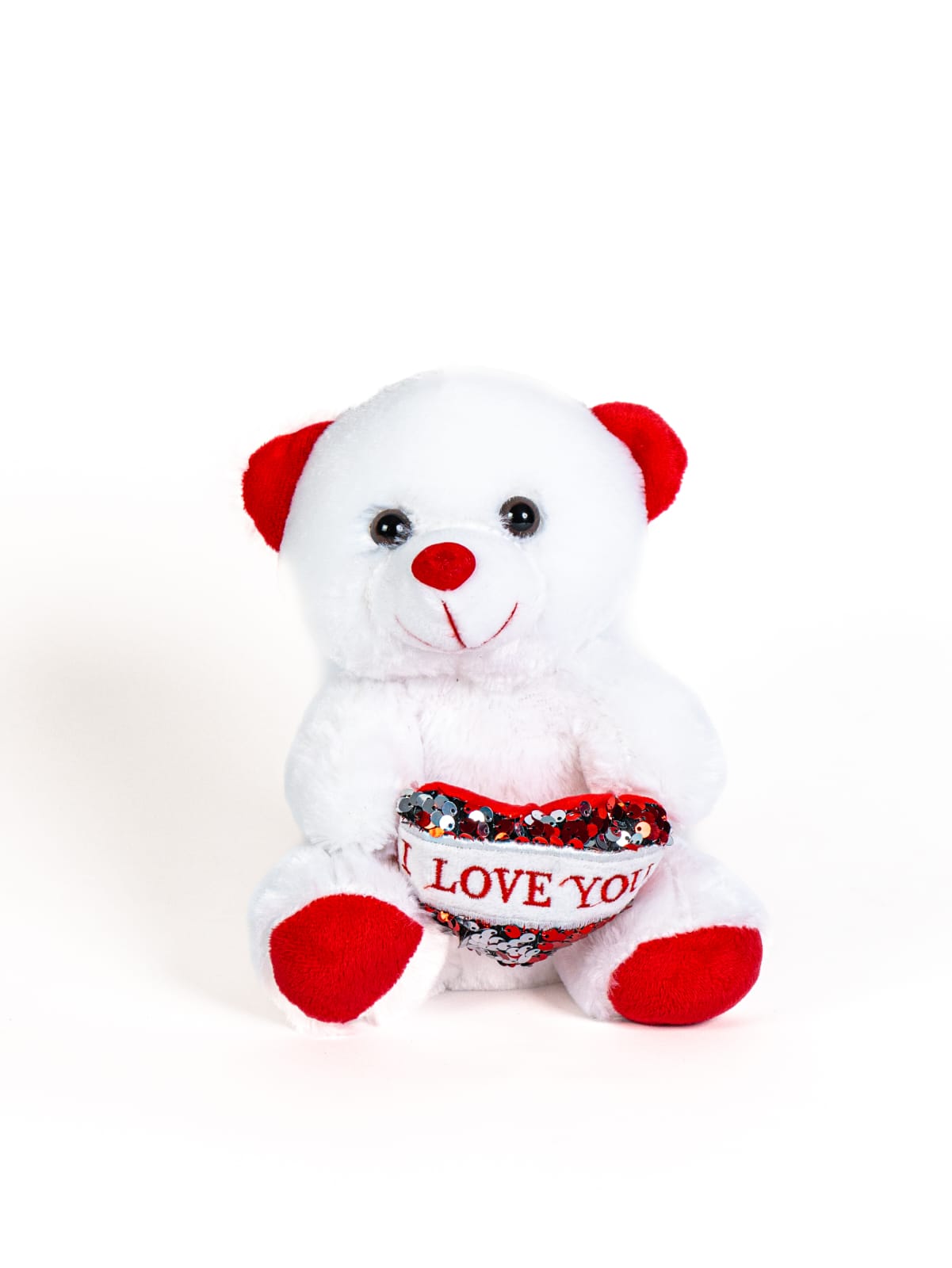 בובה של דוב לבן עם אוזניים, אף וכפות רגליים אדומות, מחזיקה לב אדום-לבן מנצנץ עם הכיתוב "I LOVE YOU".